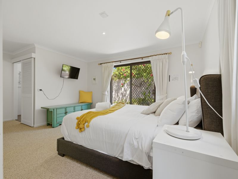 Bright guest bedroom with clean, fresh styling