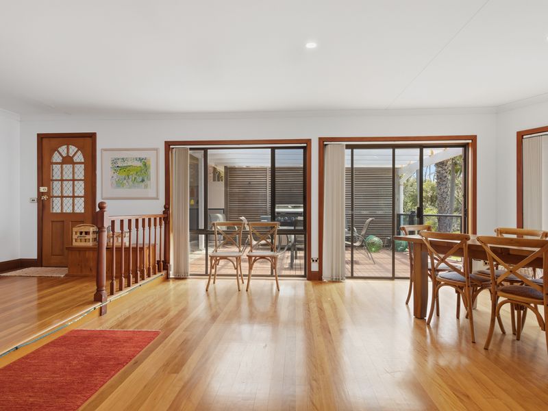 Indoor dining space opening to natural light and views