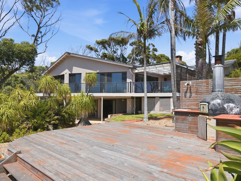 Large outdoor entertaining area with pizza oven