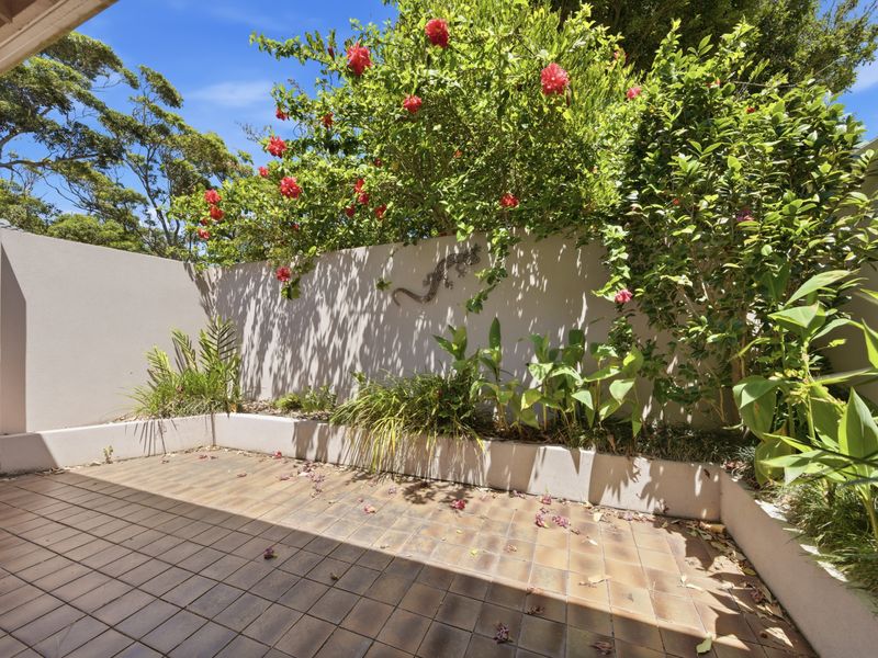 Private courtyard surrounded by greenery