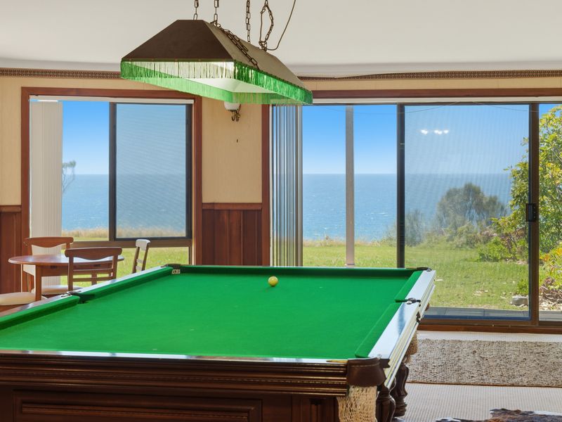 Enjoy a game of pool with beautiful outdoor views