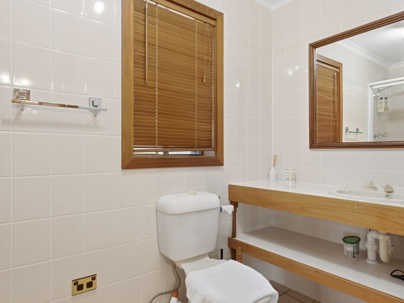 Clean, bright bathroom with modern vanity