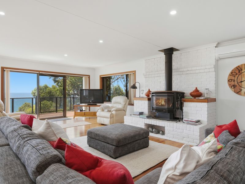 Sun-filled living room with sweeping ocean views