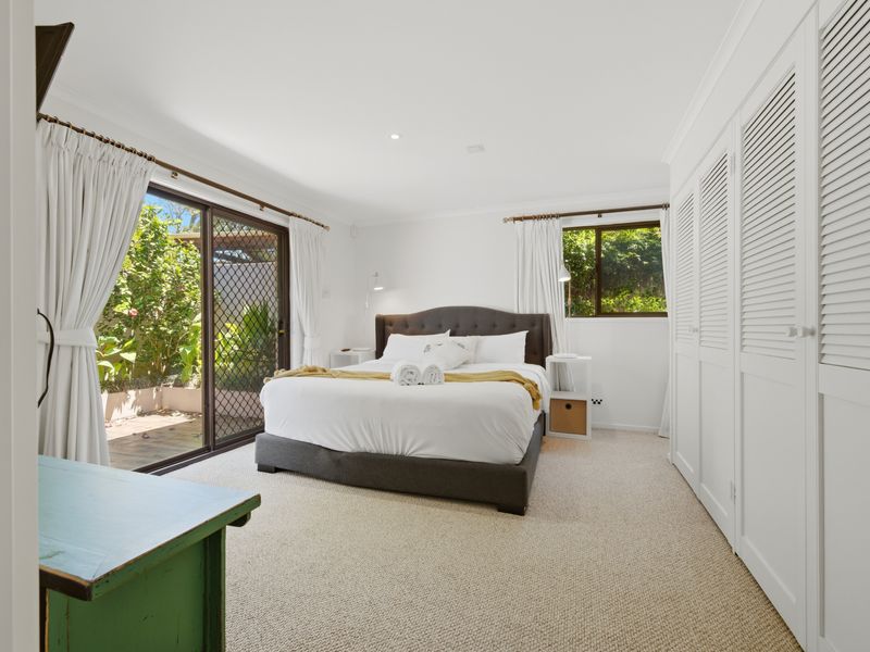 Sun-drenched master bedroom with garden outlook