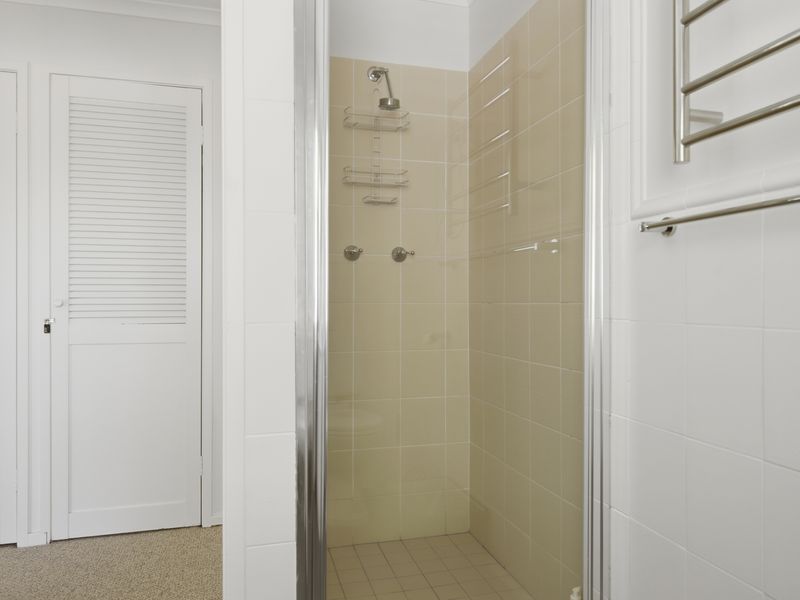 Clean, well-maintained bathroom with shower