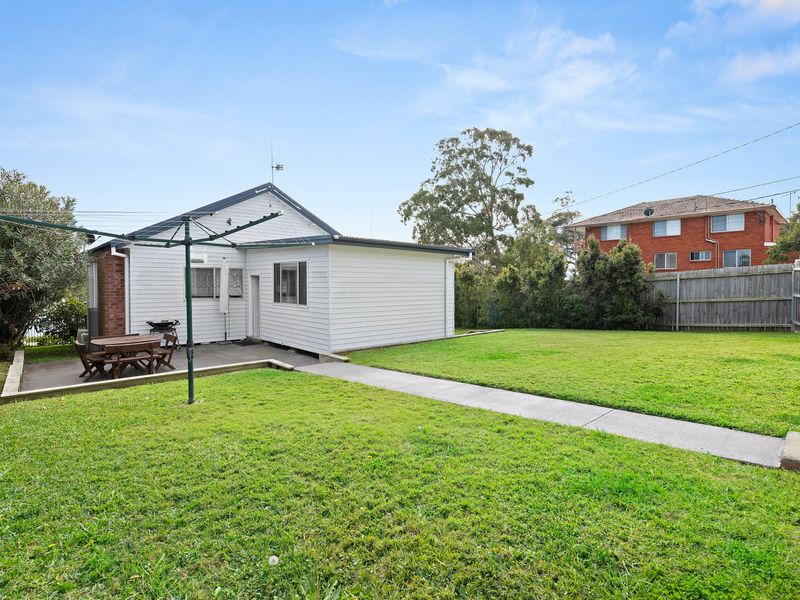 Large grassy backyard with space to unwind