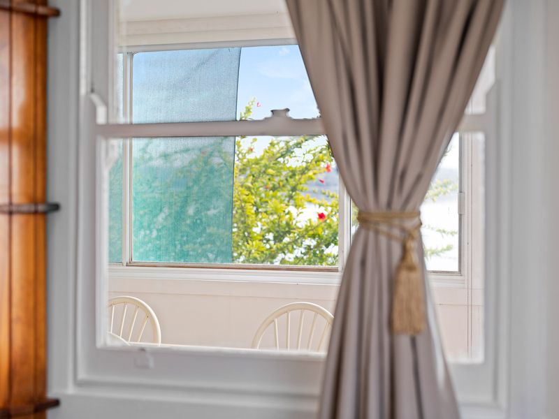 Sunlit interior with soft curtains and a calm, airy ambiance