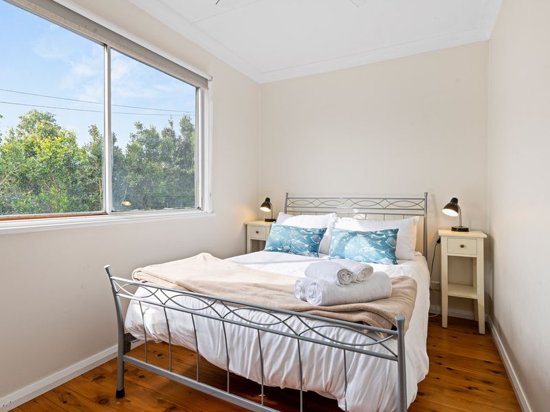 Light-filled bedroom with fresh coastal styling