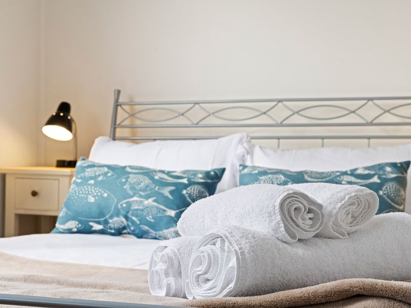 Hotel-style bedding with fresh towels provided