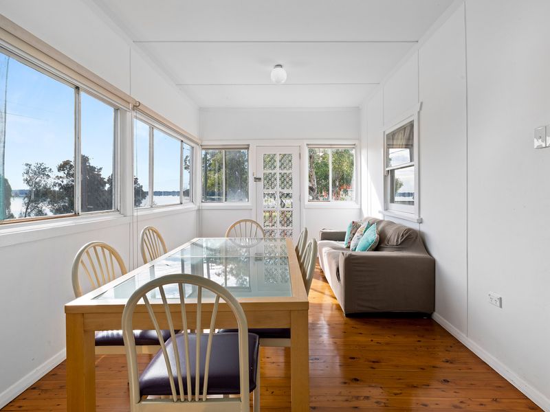 Relaxing enclosed sunroom perfect for morning coffee