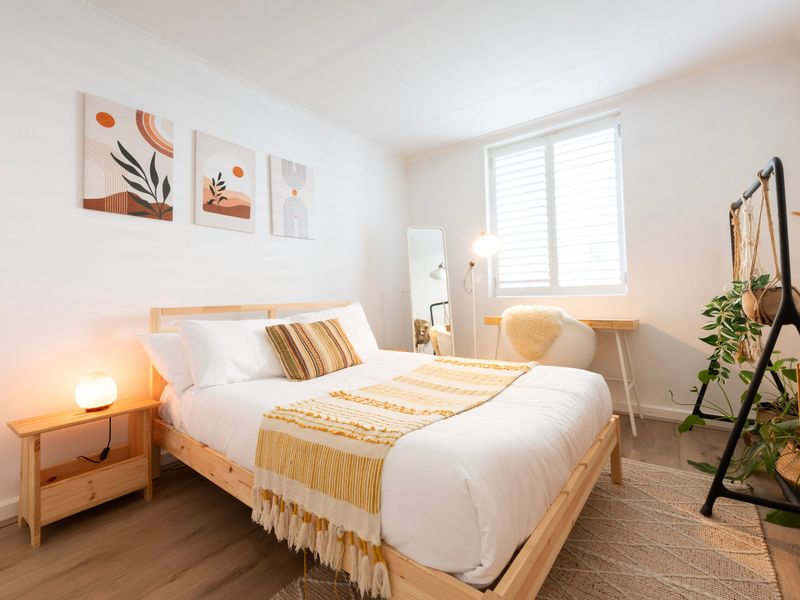 Stylish bedroom setup with natural light and greenery