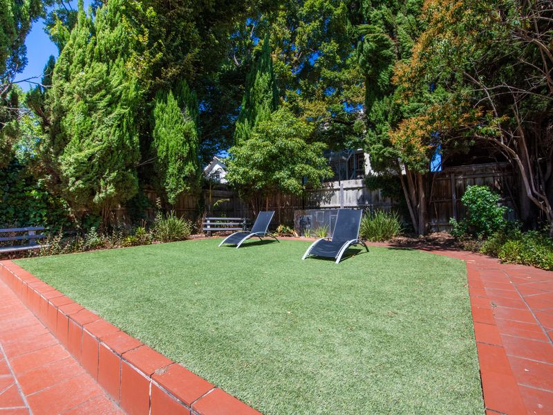 Spacious outdoor lawn area ideal for relaxing, playing, or enjoying sunny afternoons.