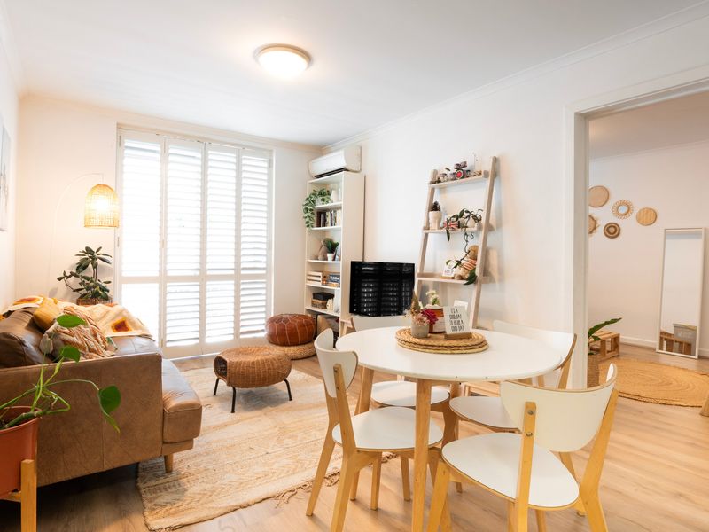 Bright open-plan living and dining area filled with natural light