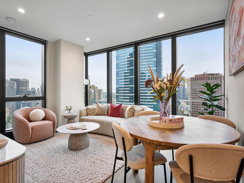 Bright open-plan living and dining with city view