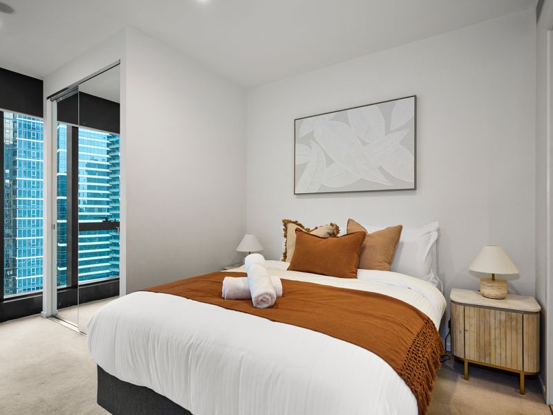 Serene main bedroom with plush linens