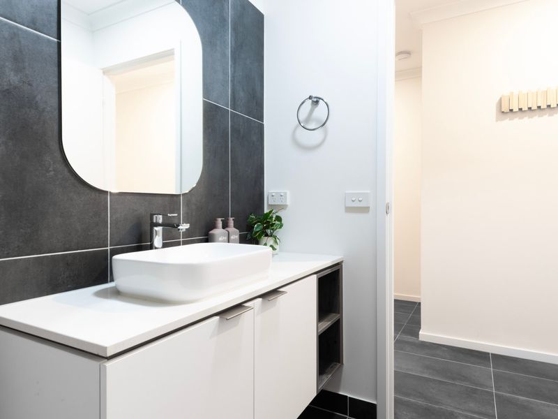 Contemporary powder room featuring sleek basin and premium finishes.