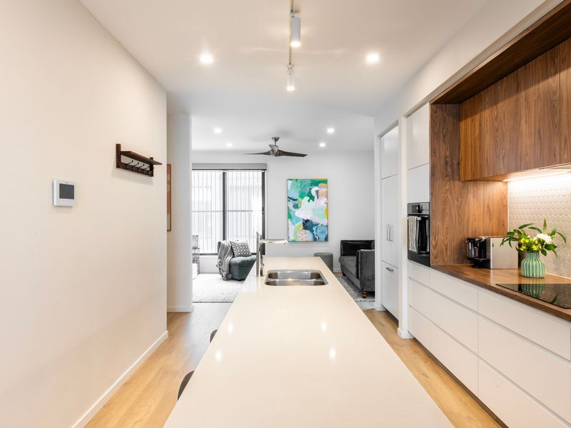 Long, bright hallway connecting the home’s spacious layout.