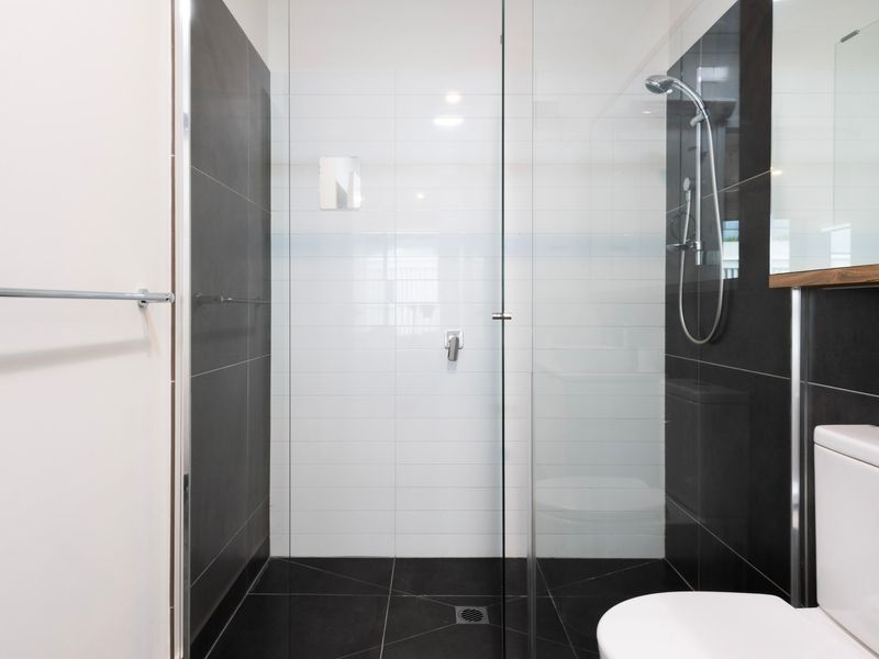 Modern walk-in shower with clean, minimalist design.