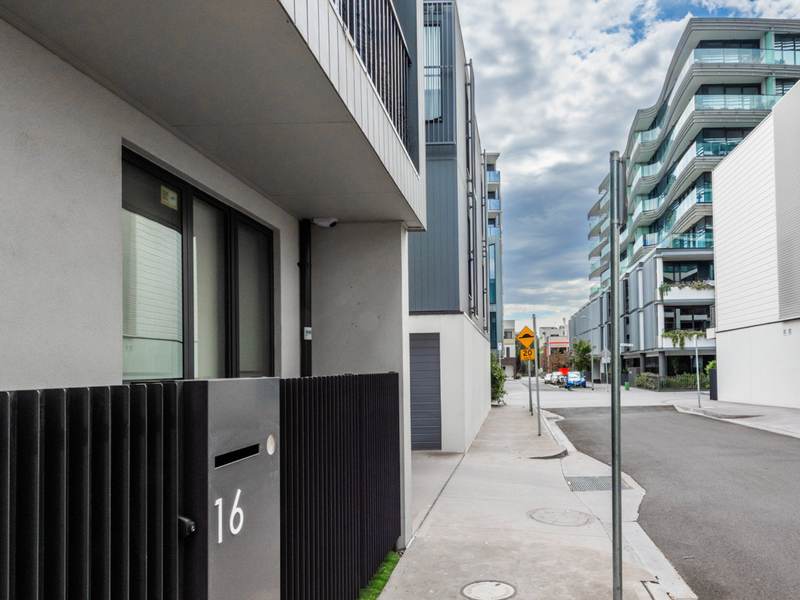 Private street-level entry with easy access and contemporary design.