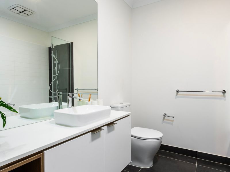 Sleek bathroom vanity with modern finishes and ample space.