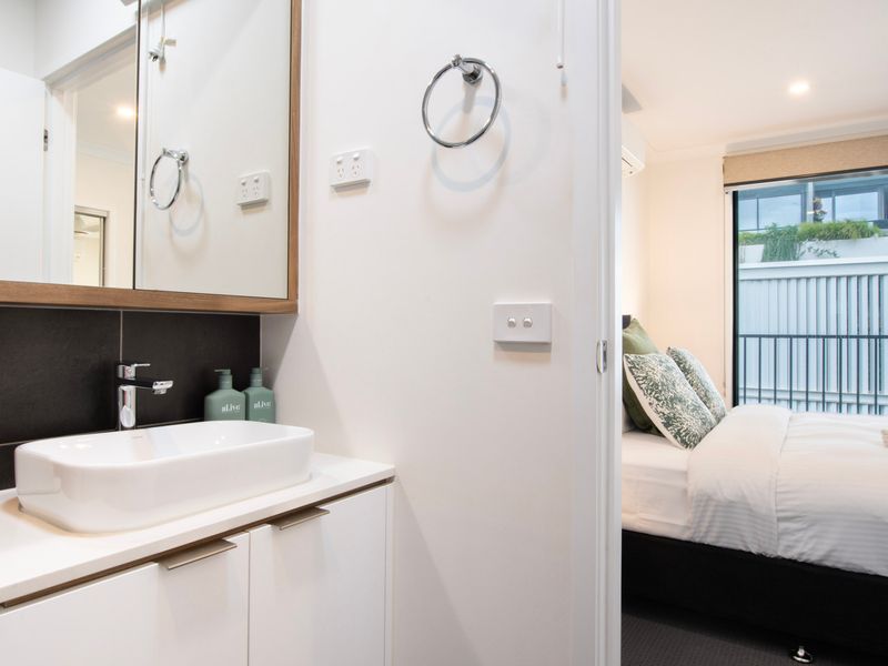 Ensuite bathroom detail with contemporary styling.