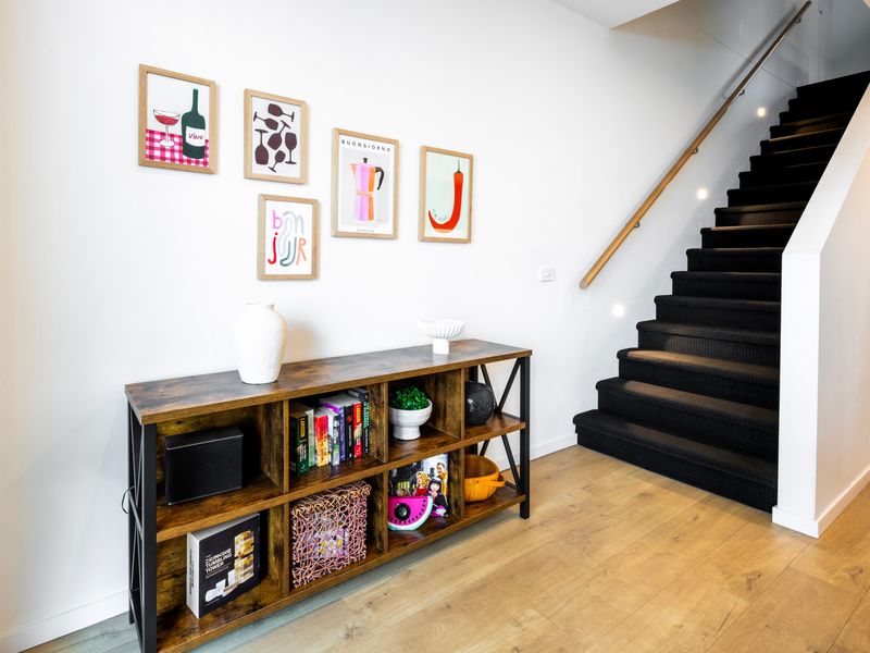 Chic staircase & reading corner with stylish décor touches.