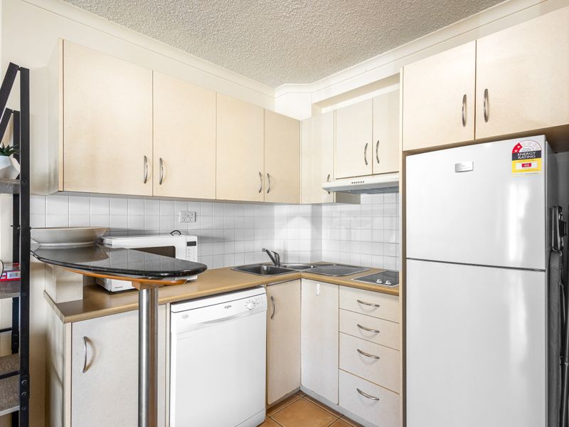 Compact, modern kitchen with all essentials for a comfortable stay.