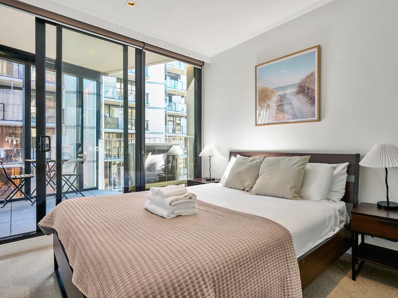 Tranquil bedroom retreat with plush bedding and warm décor.