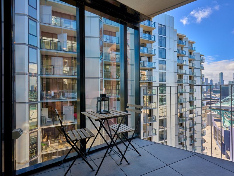 Balcony views overlooking vibrant city surrounds.