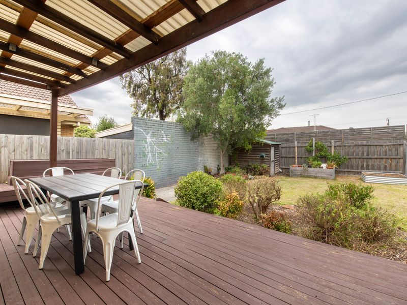 Outdoor dining deck with garden views