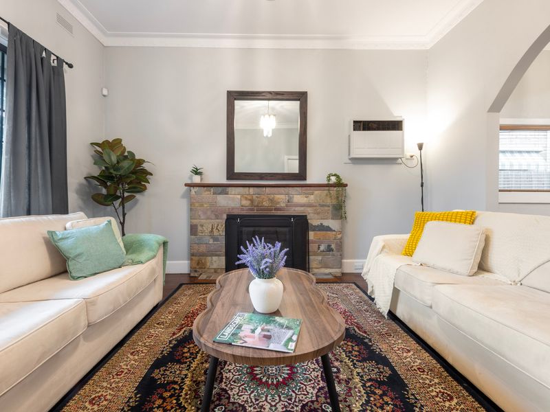 Bright lounge with plush seating and fireplace