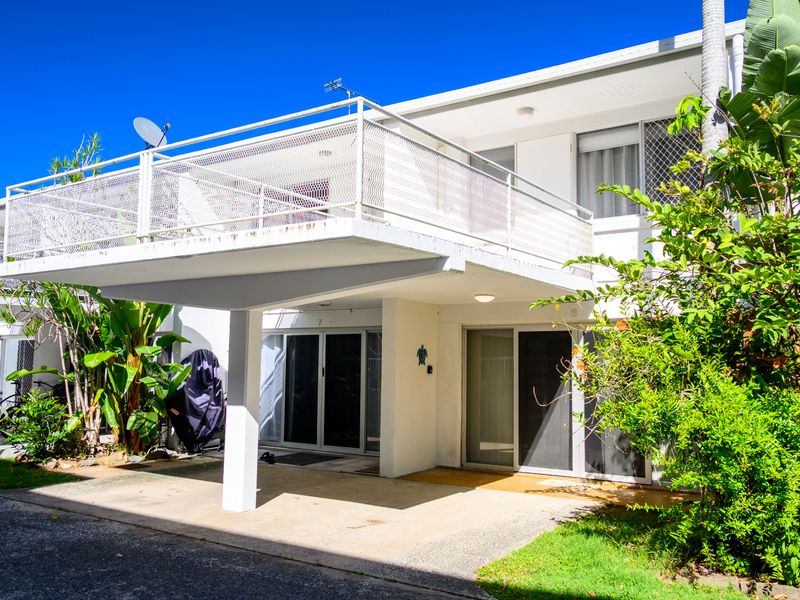 Sunny courtyard and private entrance with a relaxed coastal feel.