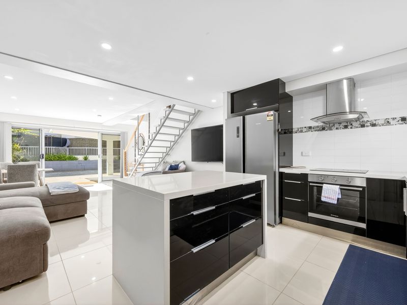 Bright kitchen overlooking the living space for easy entertaining.