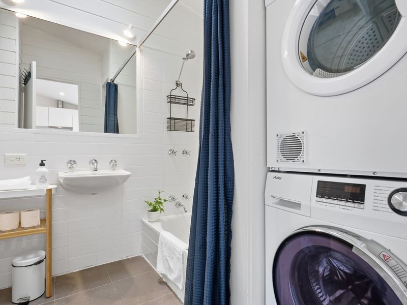 Bathroom with washer for added convenience