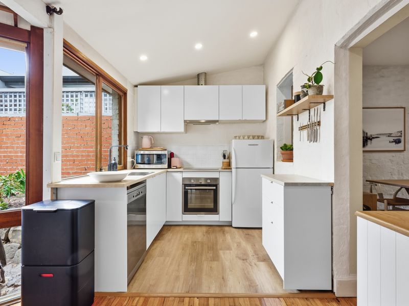 Bright and airy kitchen with seamless indoor–outdoor flow