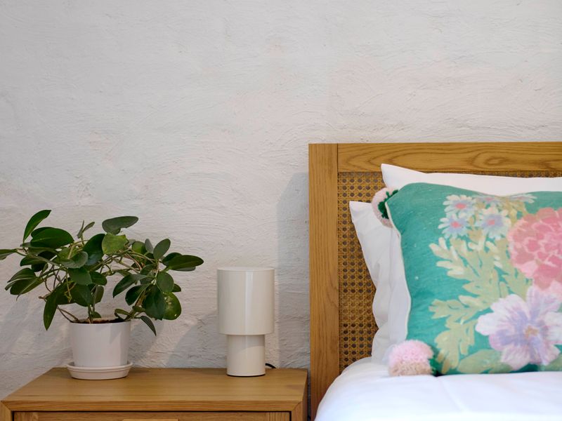 Relaxing bedroom corner with greenery accents