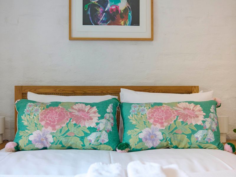 Restful bedroom with floral accents and cozy vibes