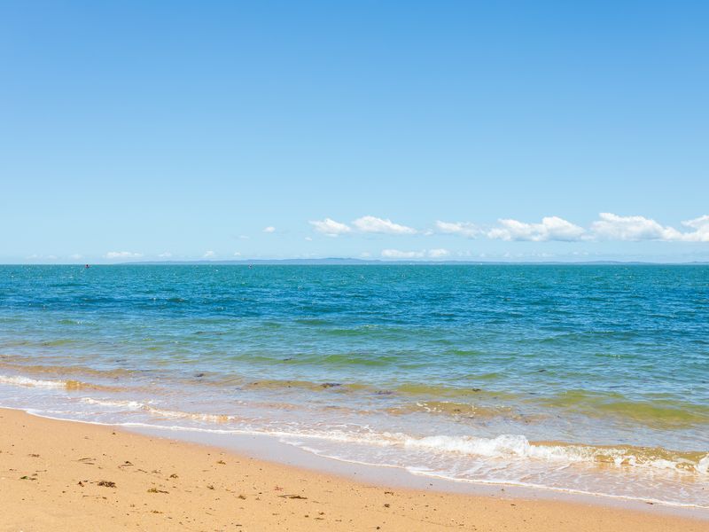 Enjoy calm waters and sandy shores only moments away.