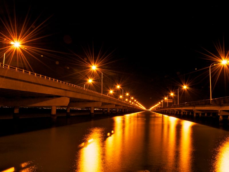 Enjoy the stunning night views of the iconic bridge lighting up the bay.