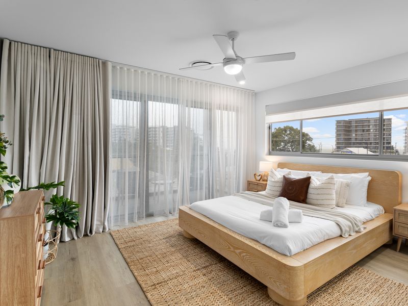 Peaceful main bedroom designed for rest and comfort.