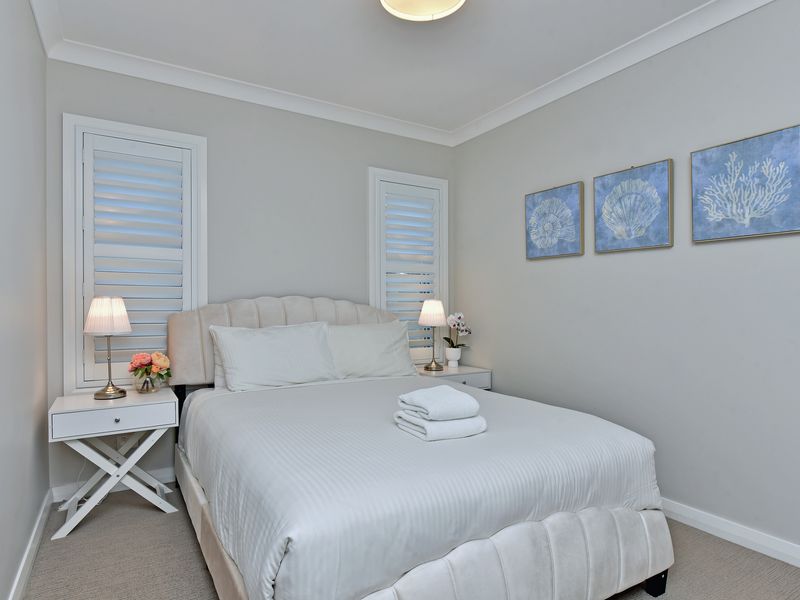 A serene white bedroom escape.
