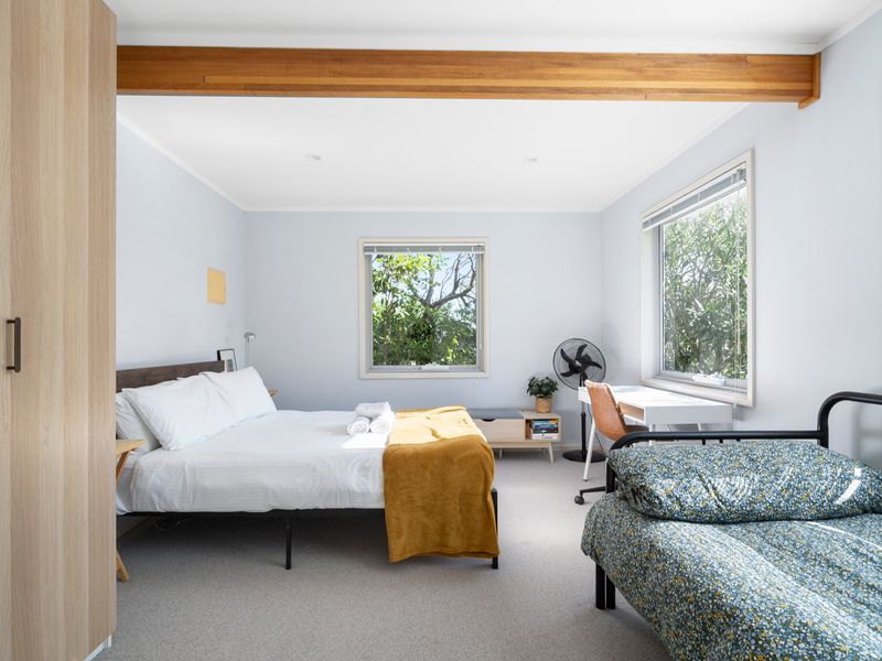 Wake gently to your queen bedroom with peaceful leafy views