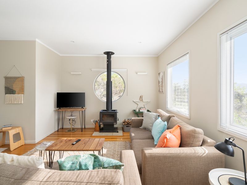 Gather by the fire with treetop views beyond