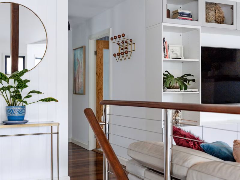 Light-filled hallway connecting the living spaces with a clean and airy design.