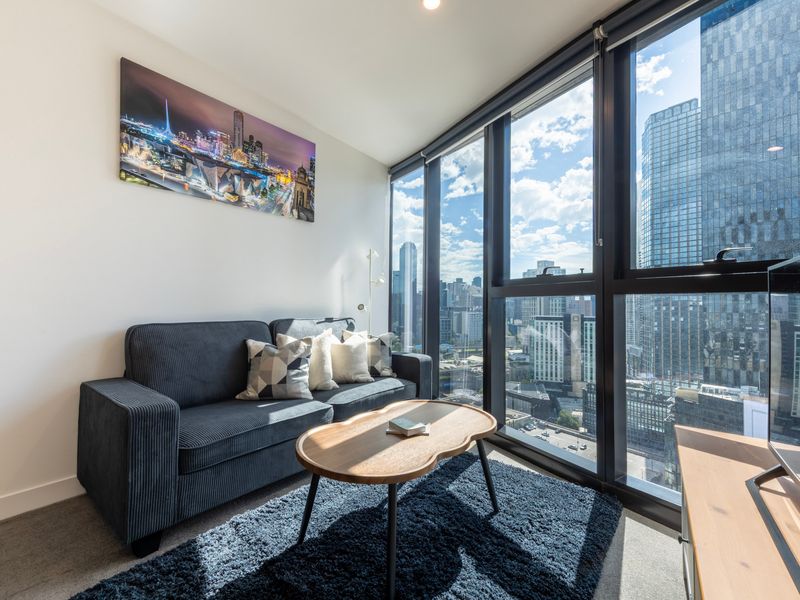 Floor-to-ceiling style city view from lounge