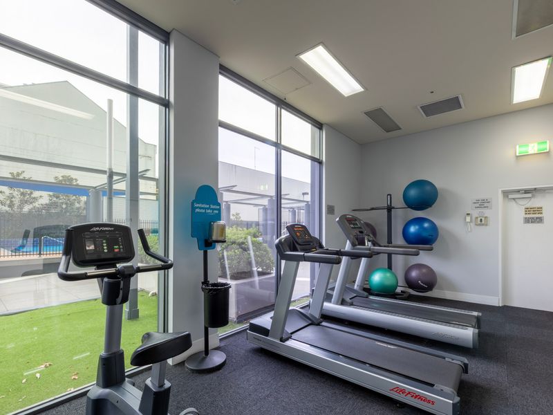 Fitness area with cardio machines and dedicated workout space