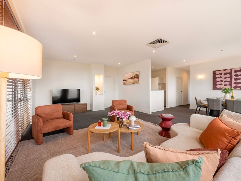 Spacious open plan living area designed for comfort, with multiple seating zones and natural flow