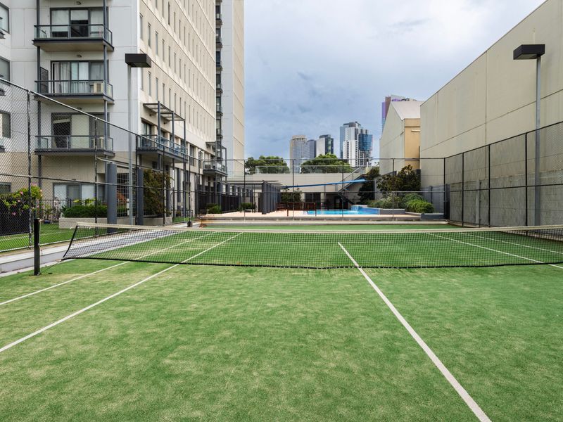 Shared outdoor tennis court within the complex