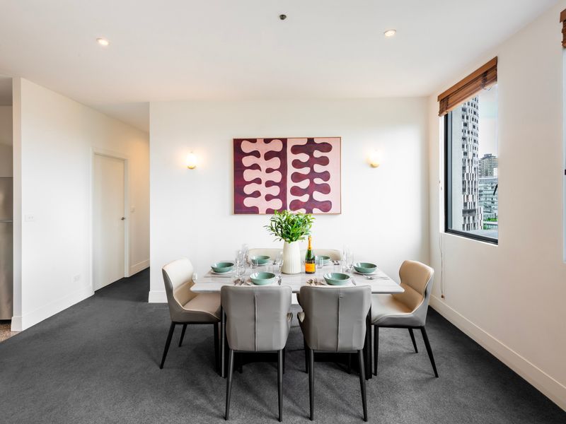 Bright 6 seater dining area positioned beside large windows