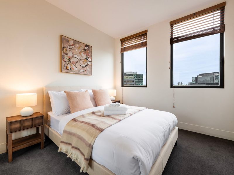 Comfortable bedroom with a double bed, warm tones and natural light throughout
